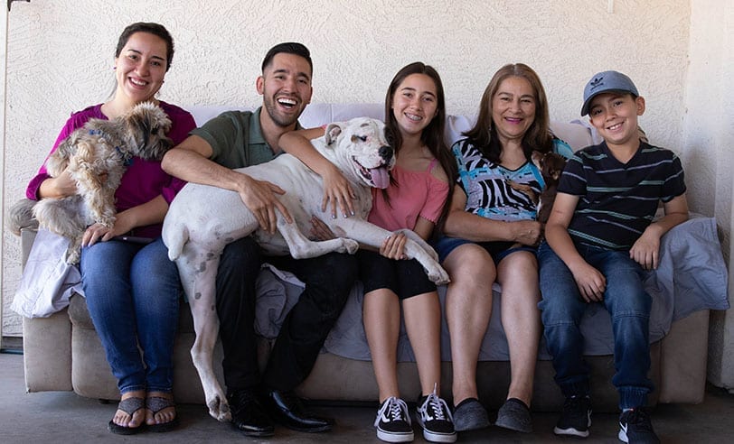 healthcare rising arizona members at home with family and dogs